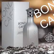 Bond No. 9 perfume bottle with its white box on a metallic surface, front and center.