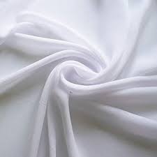 Close-up of soft white fabric twisted into a spiral fold at the center of the image.