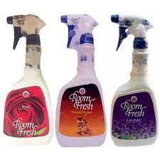 Three Room Fresh spray bottles in pink, lavender, and purple with floral labels, facing forward.