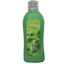 Green bottle of apple-scented dishwashing liquid for cleaning dishes