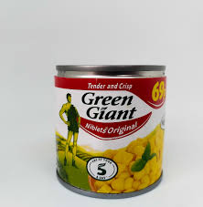 Can of Green Giant Niblets Original corn, with yellow kernels visible through the label and red-green branding on the can.