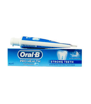 Oral-B Pro-Health Strong Teeth toothpaste box with a toothpaste tube resting on top.