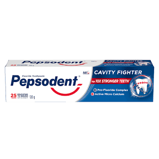 Pepsodent toothpaste box displaying 'Cavity Fighter' and 'Active Micro Calcium' on blue-and-white packaging (oral care product)
