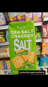 Bright green bag of salt crackers on a store shelf, with large white 'SALT' lettering on the front.