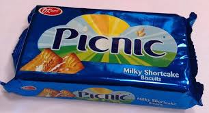 Blue wrapper of Picnic Milky Shortcake Biscuits featuring a crescent sun logo and a biscuit image on the front panel, indicating the product name and flavor.