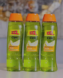 Three green detergent bottles with orange caps labeled 'XXL Cien Power Gel' arranged in a row.